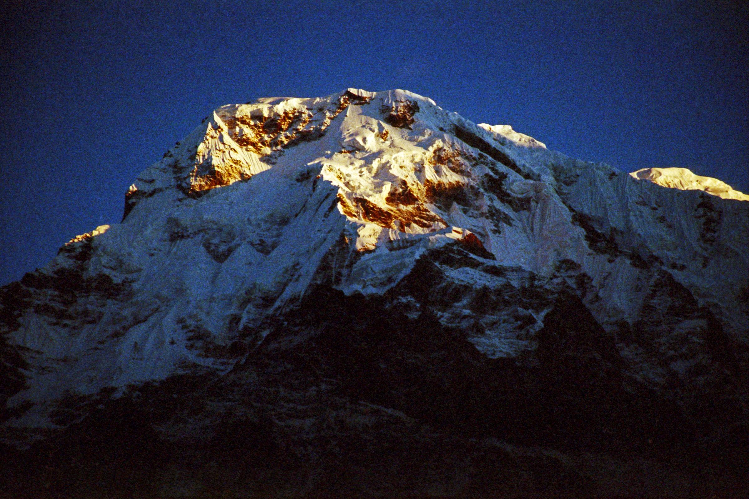 102 Annapurna South Sunrise From Chomrong The sun slowly started to rise, shining very brightly on Annapurna South, taken from Chomrong.